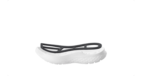 Shoe midsole with a black skeletal insert on top, showing the white textured sole.