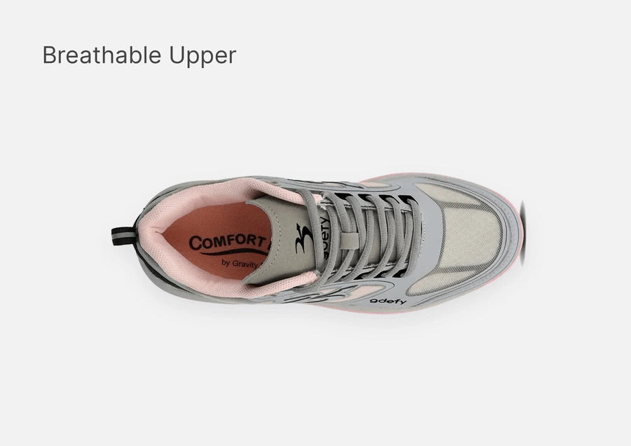 Grey and pink athletic sneaker, top-down view, highlighting the breathable mesh upper and 'COMFORT by Gravity' insole.