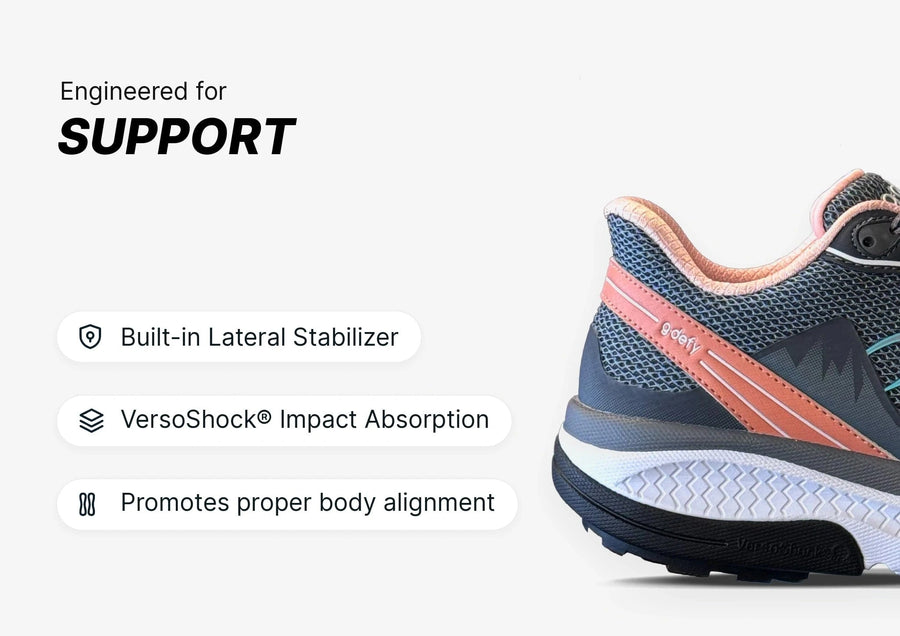 gdefy running shoe, dark grey mesh with coral accents, showcasing its supportive design and thick VersoShock sole.