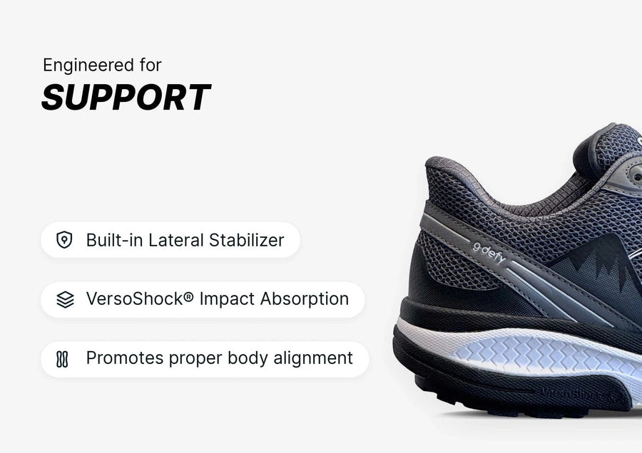 Black and white g-defy athletic shoe, engineered for support with a built-in lateral stabilizer and VersoShock® impact absorp