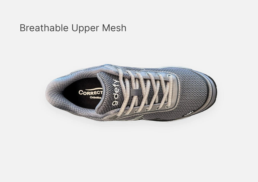 Gray athletic shoe with breathable mesh upper, light gray laces, and "9.defy" logo, viewed from top-down.