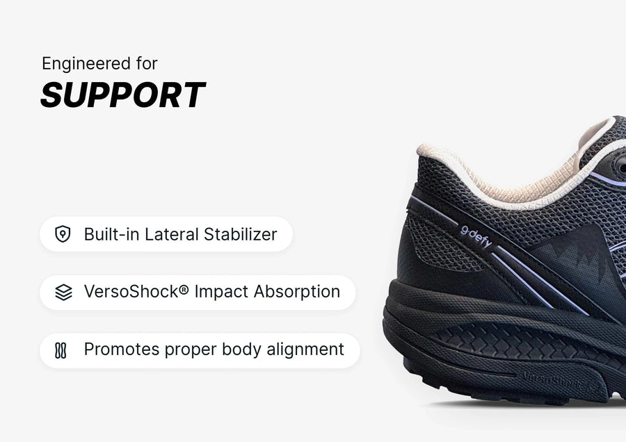 Black athletic running shoe with mesh upper and thick sole, highlighting built-in lateral stabilizer and VersoShock® impact a