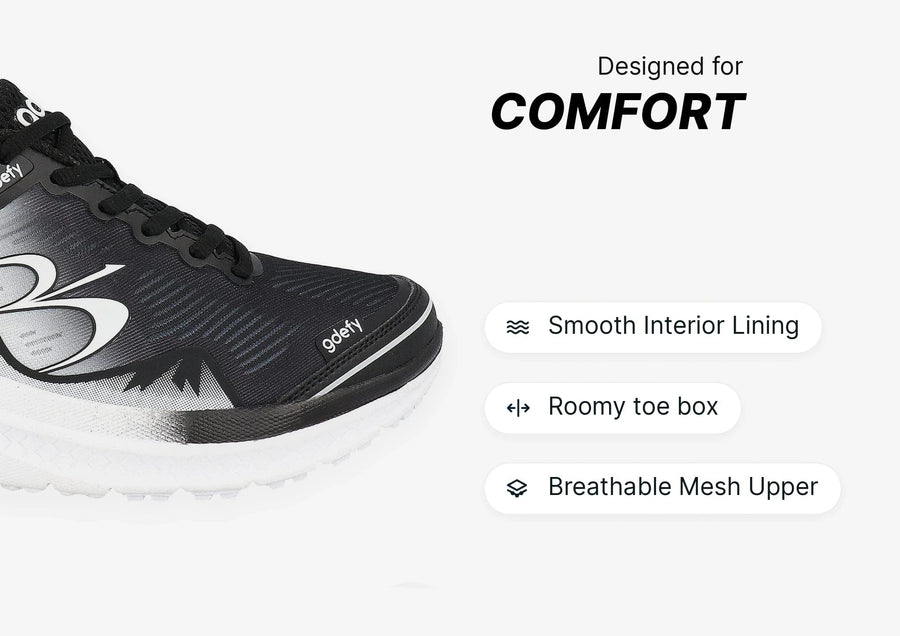 Black and white athletic shoe with breathable mesh upper, roomy toe box, and smooth interior lining for comfort.