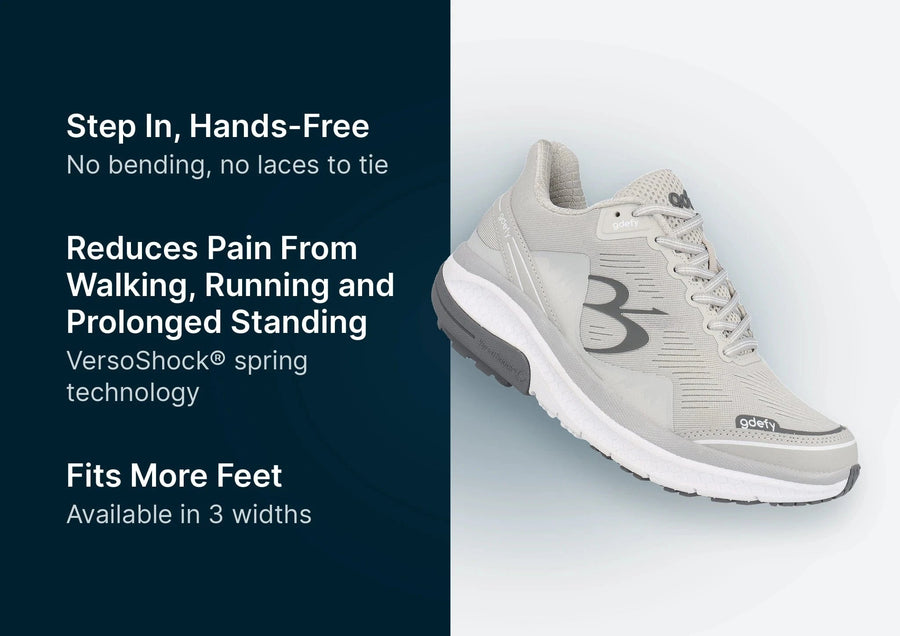 Light gray athletic shoe with a thick white VersoShock sole, dark gray logo, and 'gdefy' branding.
