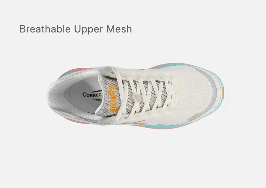 Top view of the white sherbet g-defy MightyWalk slip-on sneaker showing its breathable upper mesh.