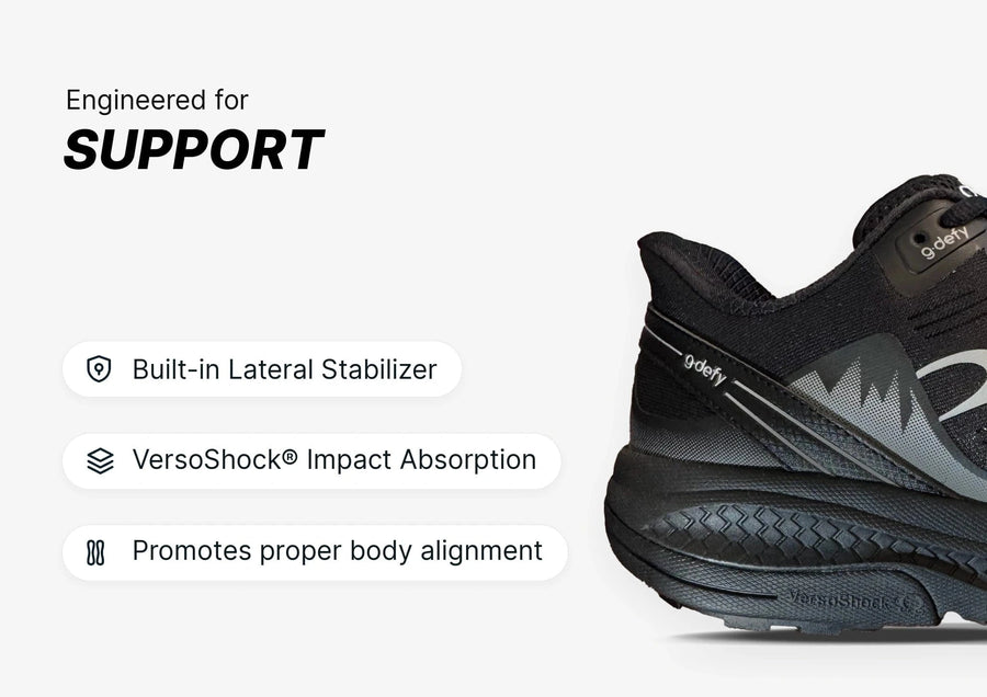 Black g-defy athletic shoe, engineered for support with a built-in lateral stabilizer and VersoShock impact absorption.
