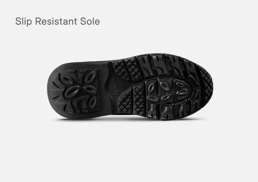 Outsole of the g-defy MightyWalk men's slip-on sneaker with a slip resistant tread pattern.