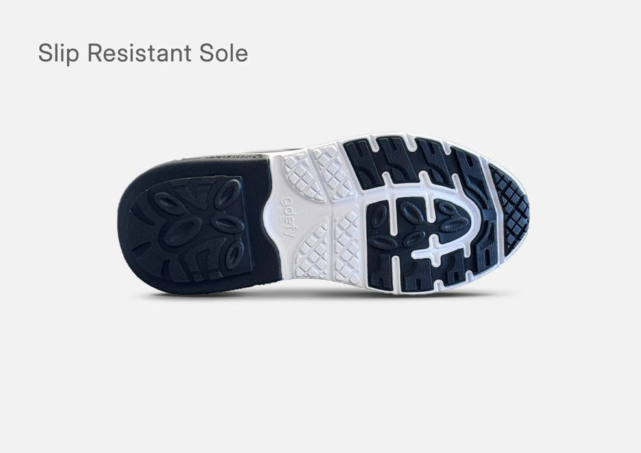 Outsole of the g-defy MightyWalk men's slip-on sneaker with a slip resistant tread pattern.