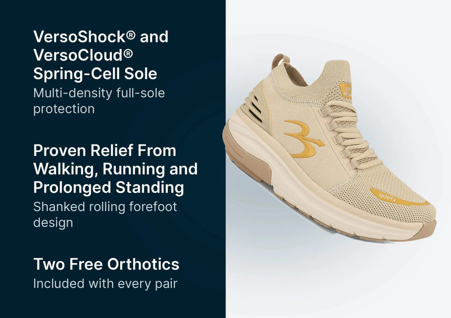Beige GDEFY athletic shoe with a knitted mesh upper, thick sole, gold brand logo, and "GDEFY" on the toe.
