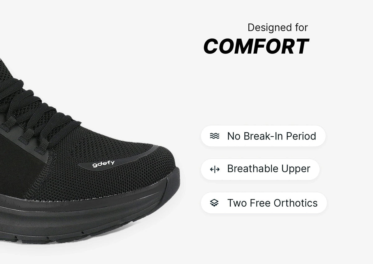 Black athletic shoe with mesh upper and laces, featuring a breathable design for comfort and no break-in period.