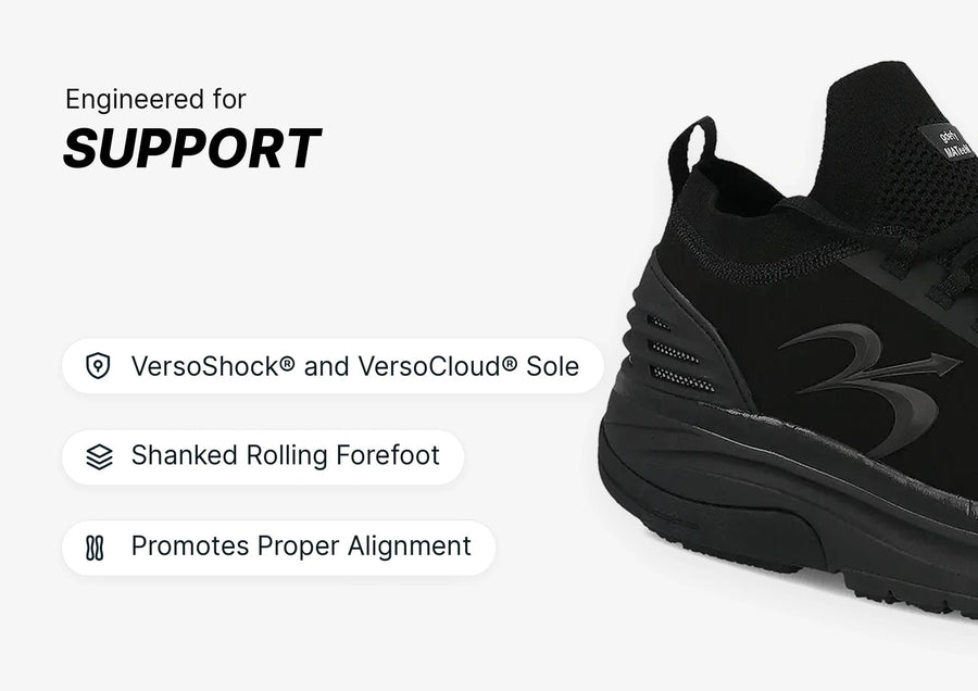 Black athletic shoe, side view, highlighting VersoShock® and VersoCloud® Sole and shanked rolling forefoot for support.