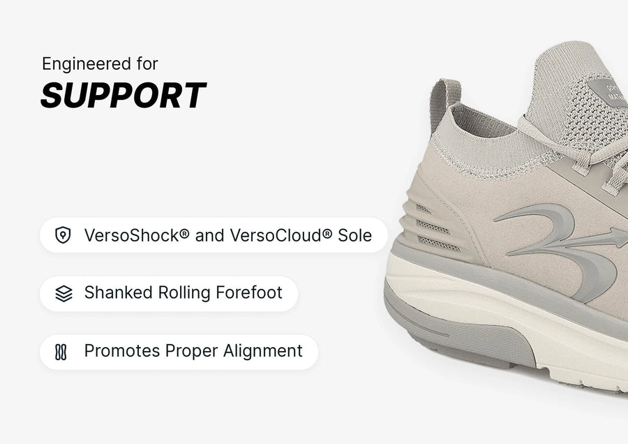 Light grey athletic shoe with a thick, sculpted sole and knit upper, highlighting its supportive features.