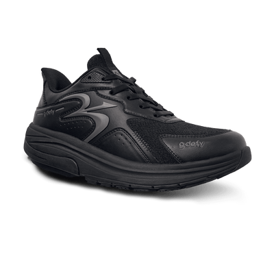 Black G-Defy sneaker with mesh and leather-like upper, thick sole, and black laces, angled view.