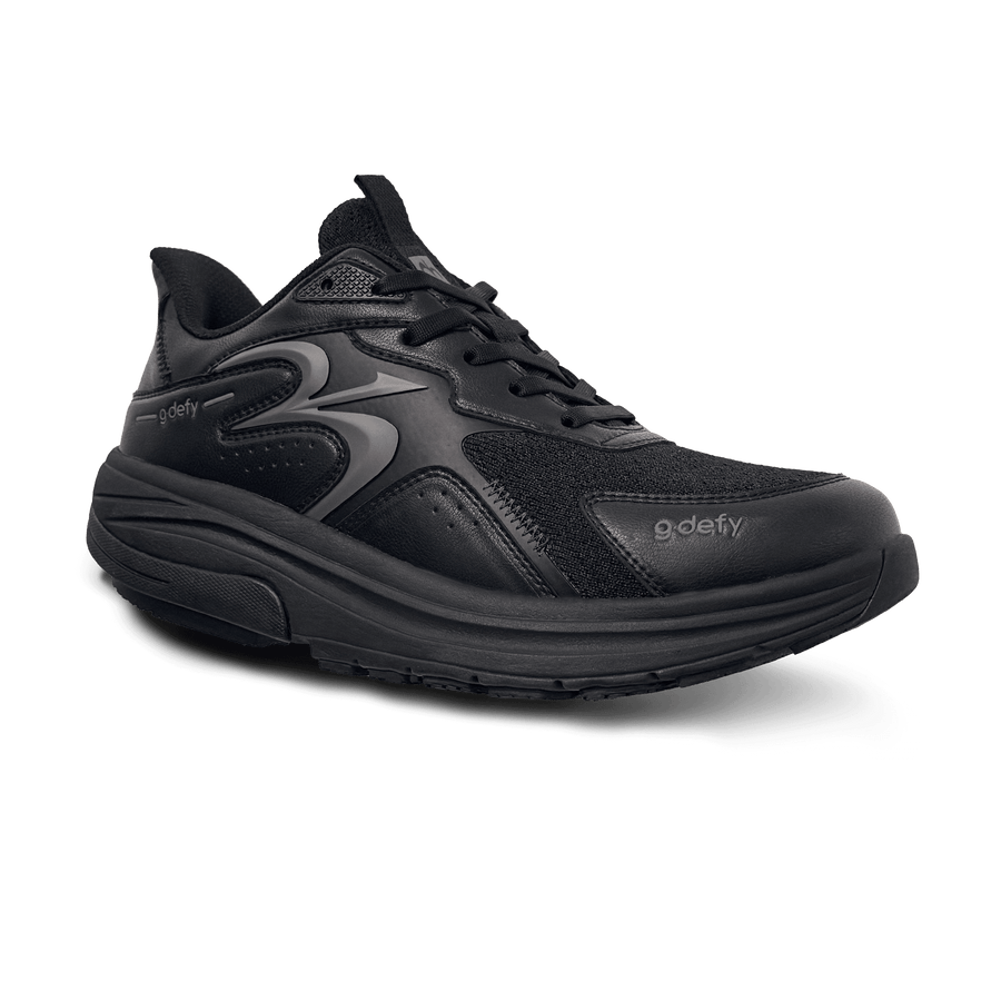 Black G-Defy sneaker with mesh and leather-like upper, thick sole, and black laces, angled view.
