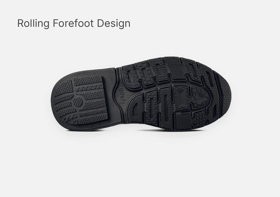 Black shoe outsole with a textured grip pattern and 'gdefy' logo, highlighting its rolling forefoot design.