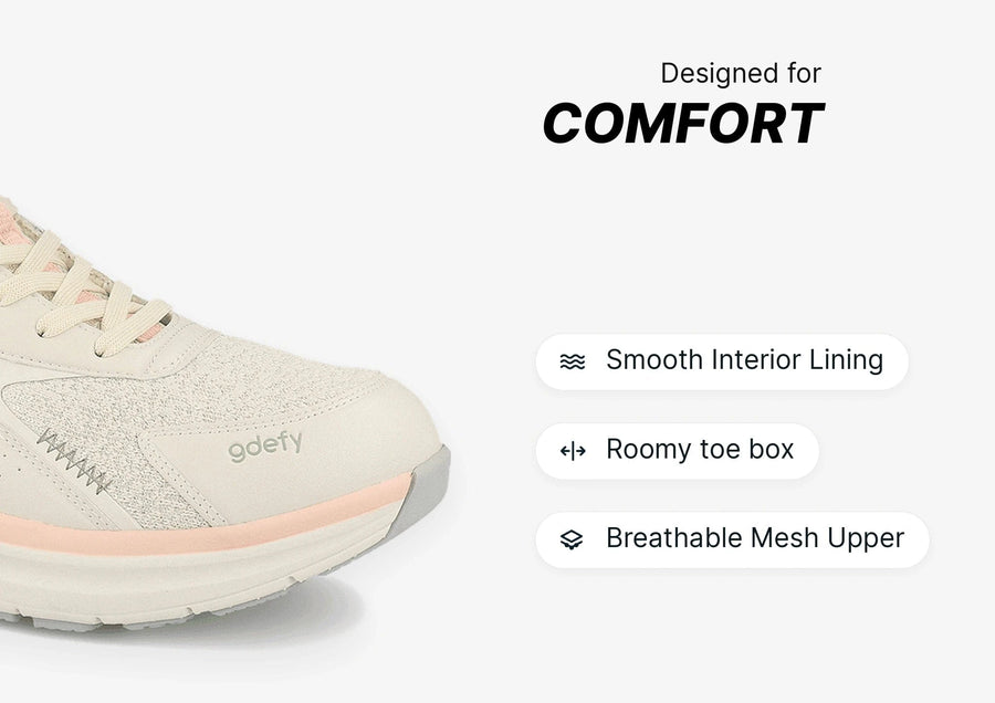 Gdefy beige and pink athletic shoe with breathable mesh upper, roomy toe box, and smooth interior lining for comfort.