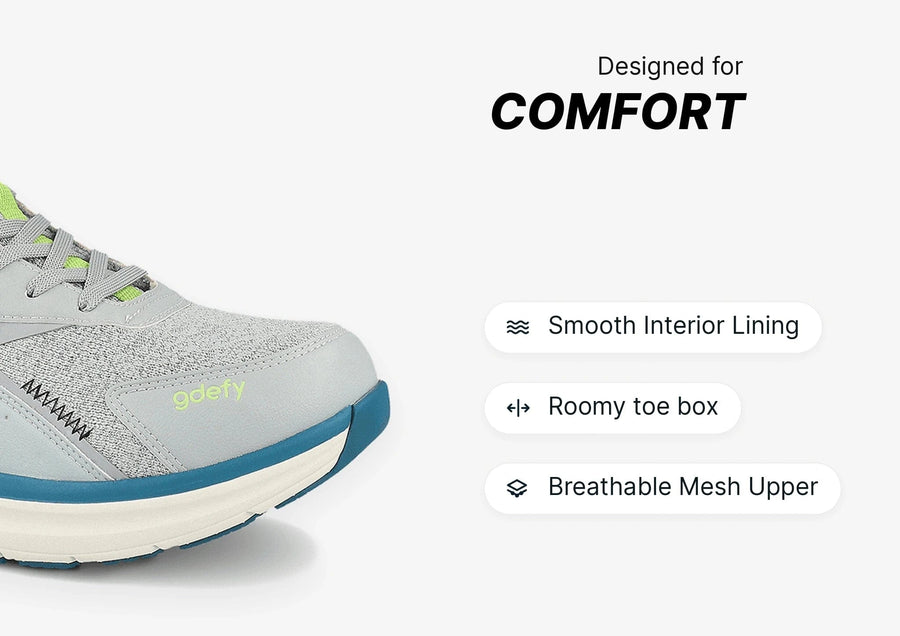 Grey and lime green running shoe with breathable mesh upper, roomy toe box, and smooth interior lining for comfort.