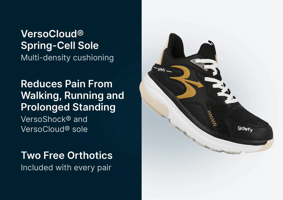 Black and gold athletic shoe with white laces and a thick white and beige sole, featuring "gdefy" branding.