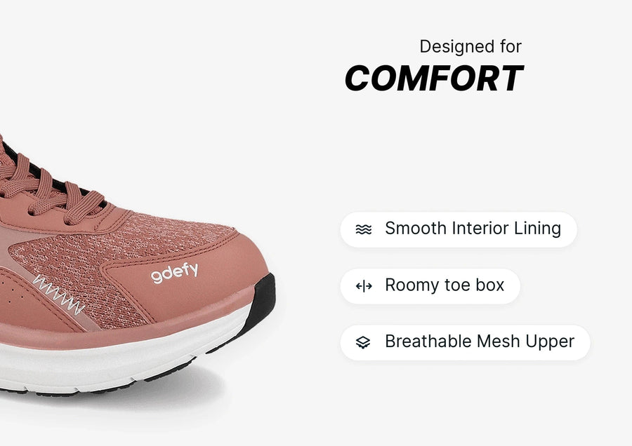 Rose gold athletic sneaker with breathable mesh upper, smooth interior lining, and roomy toe box for comfort.