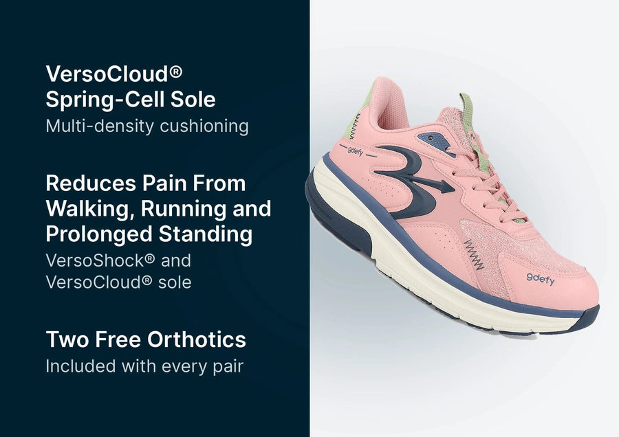 Pink gdefy athletic shoe with navy accents, light green details, and a thick cream VersoCloud® Spring-Cell sole.