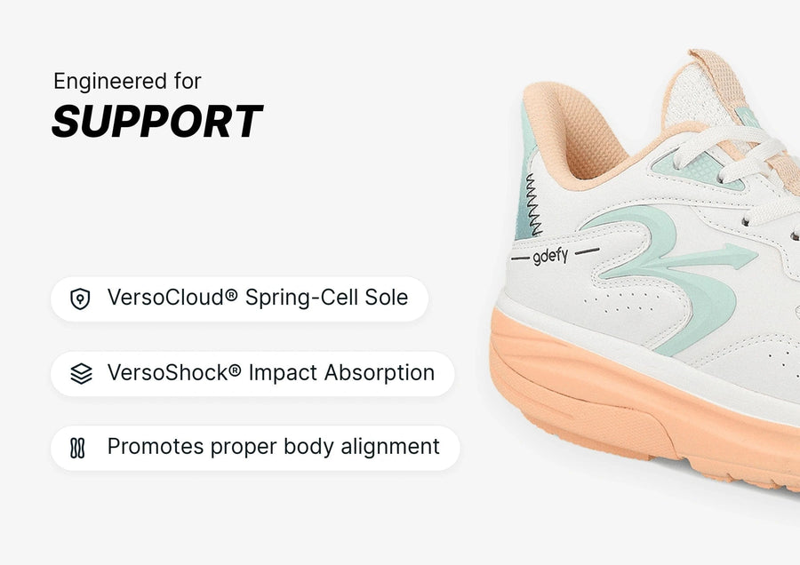 White and peach athletic shoe with light green accents, showcasing its supportive design and VersoCloud® Spring-Cell Sole.