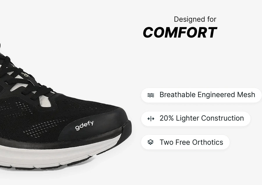 Black running shoe with white sole, featuring breathable engineered mesh and lightweight construction for comfort.