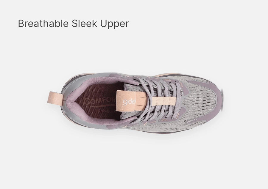 Grey and light pink athletic sneaker, top-down view, showcasing its breathable mesh and sleek upper design.