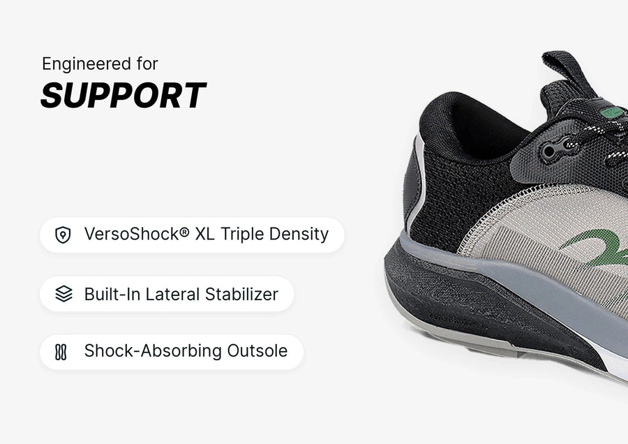 Black and grey athletic shoe, close-up of the side showing VersoShock XL Triple Density sole and lateral stabilizer for suppo