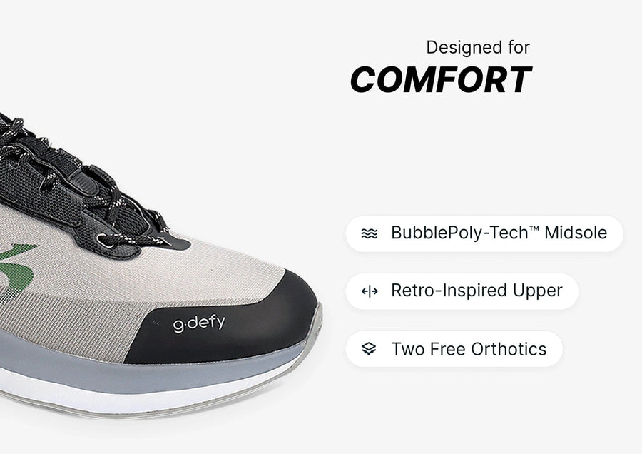 Grey and black g.defy athletic shoe with a retro-inspired upper and BubblePoly-Tech midsole, emphasizing comfort.