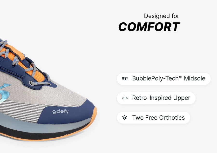 Grey, navy, and orange g.defy athletic shoe with a mesh upper and thick sole, emphasizing comfort.