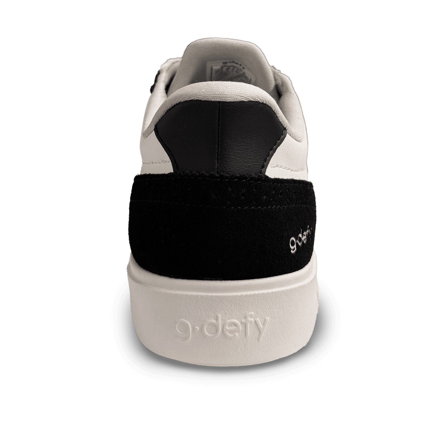 White leather and black suede sneaker, back view, featuring "g-defy" embossed on the white sole and embroidered on the heel.