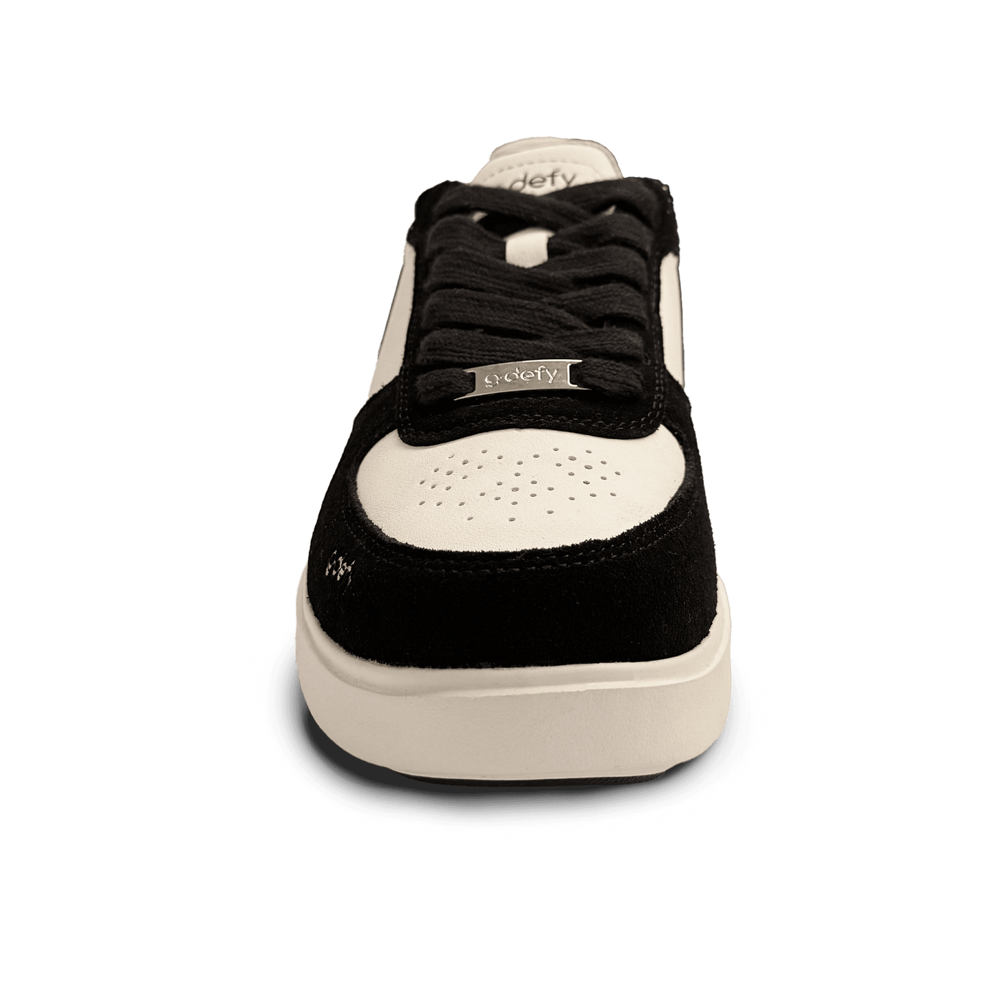 Black and white low-top sneaker with black laces and a silver 'g-defy' tag, featuring a perforated toe box.