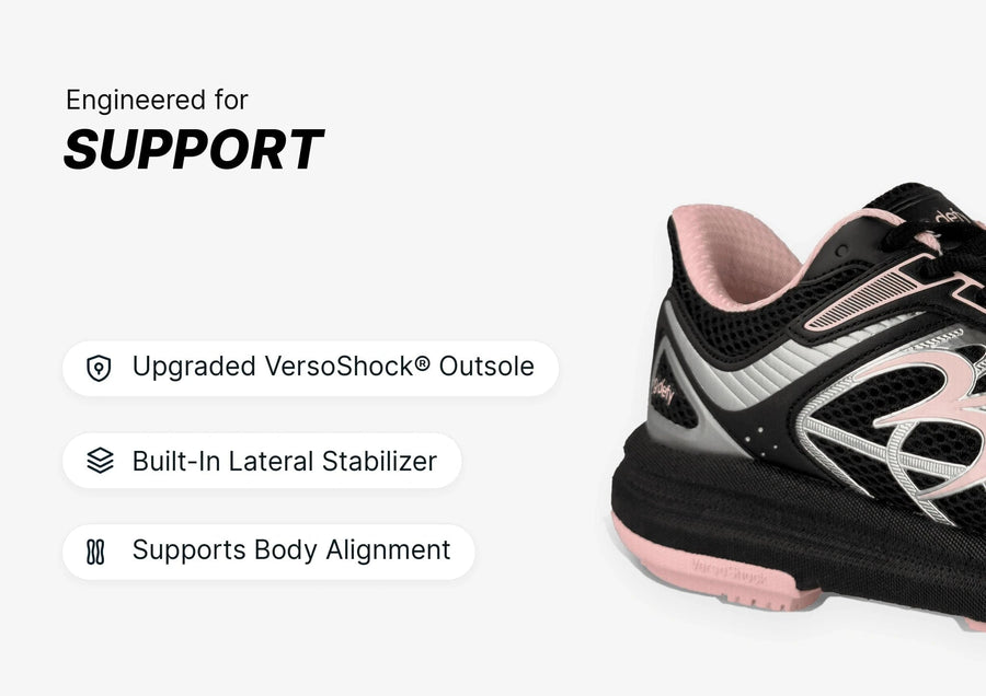 Black and pink athletic shoe with mesh upper and silver accents, showcasing its VersoShock® Outsole and lateral stabilizer fo