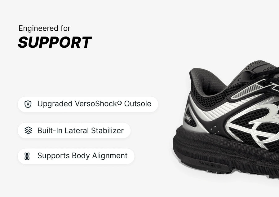 Black and silver athletic shoe with mesh upper and thick VersoShock outsole, highlighting support features.