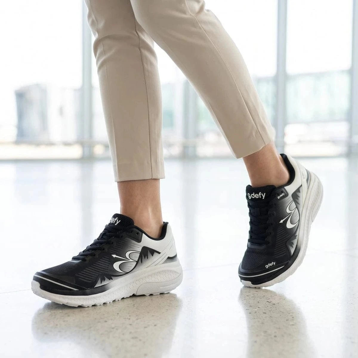GDEFY Women’s MightyWalk Ombre Slip-On shoes on a polished indoor floor